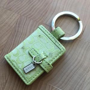 Small coach key chain photo holder green.